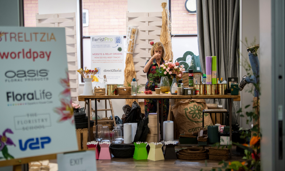 Florist at bench of florist glow up